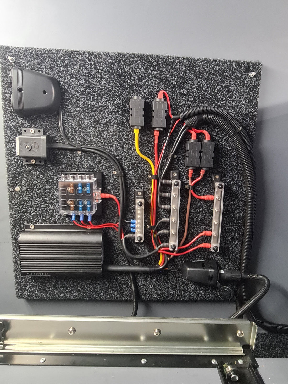 DC charger, fuse block and busbars wired on a backing board for a second battery circuit