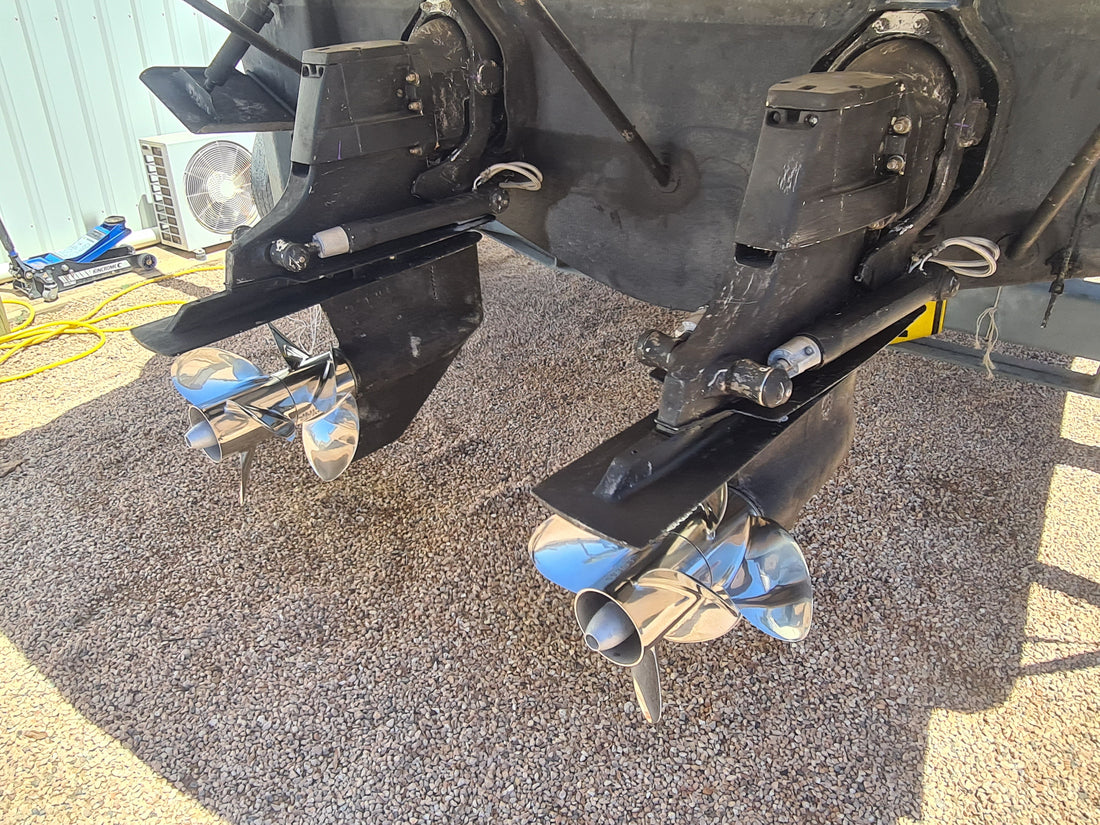 Sterndrive units removed from a boat and set down in the yard for inspection