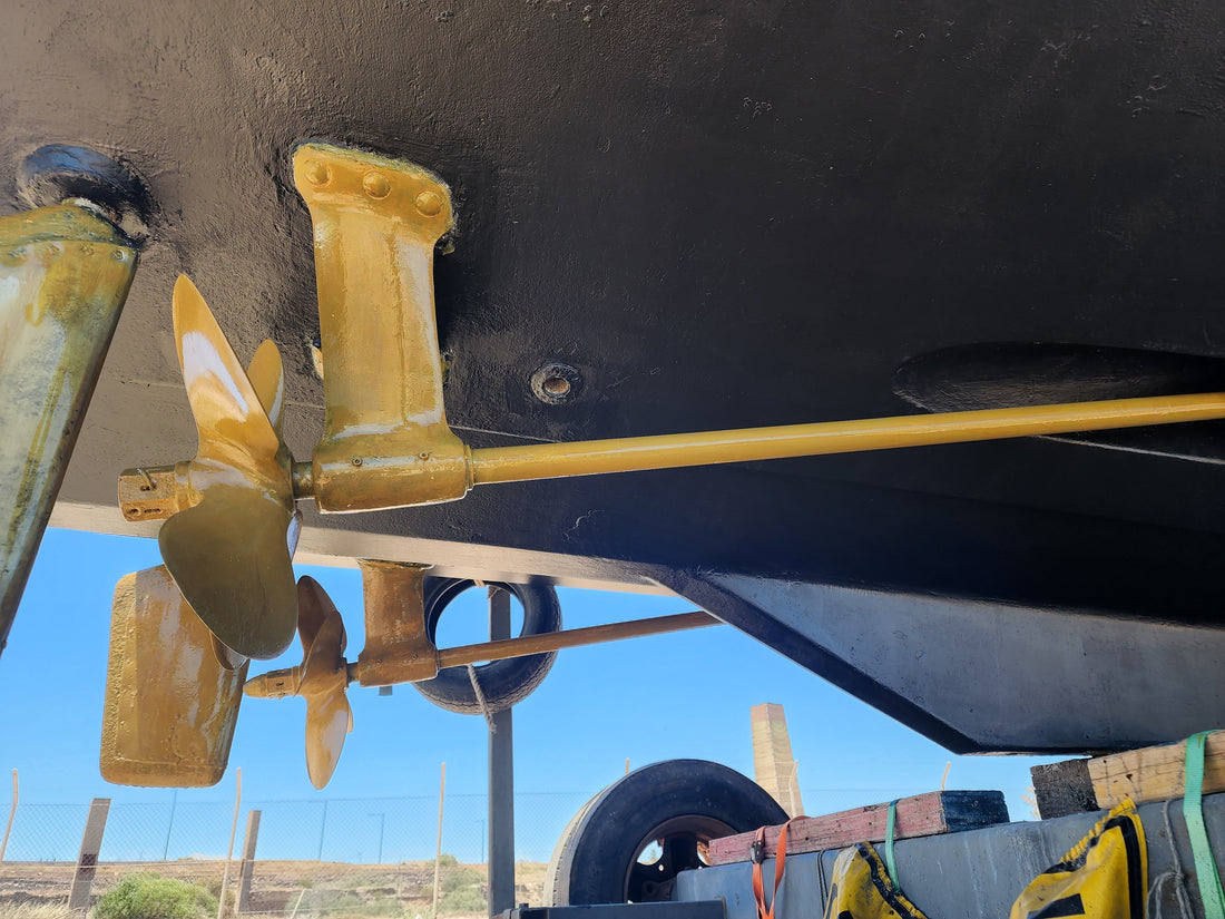 Twin propeller shafts and propellers beneath a freshly antifouled hull