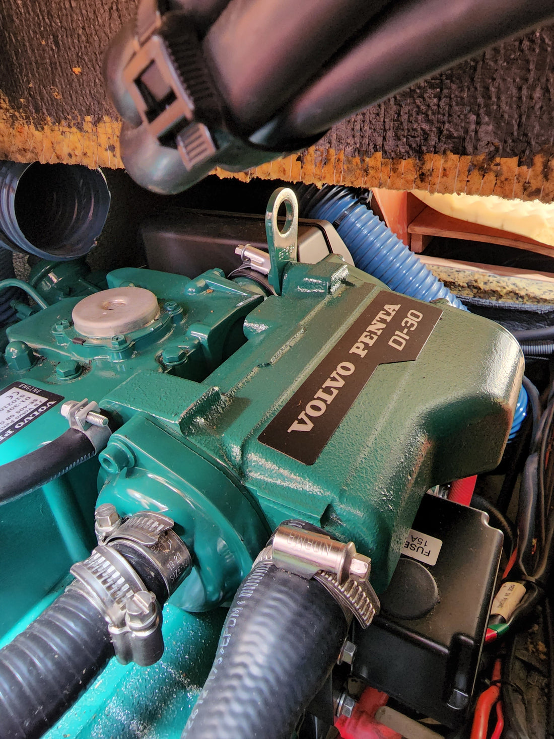 Close-up of a Volvo Penta marine diesel showing the engine identification decal area